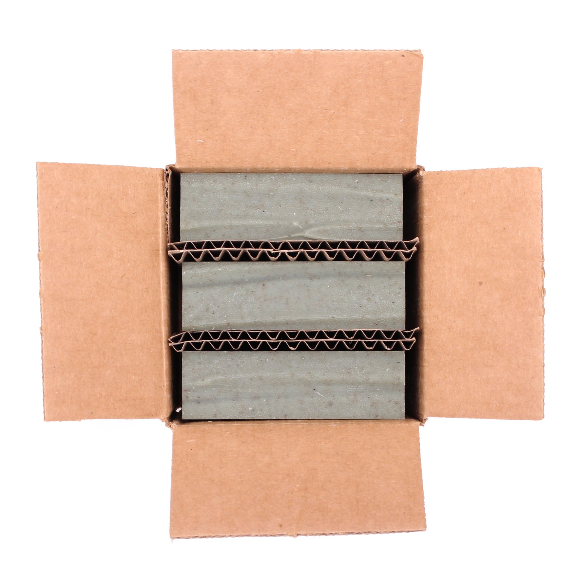 A naked three pack of Grove cedar & pine essential oil and rhassoul clay organic bar soap from ground Soap.